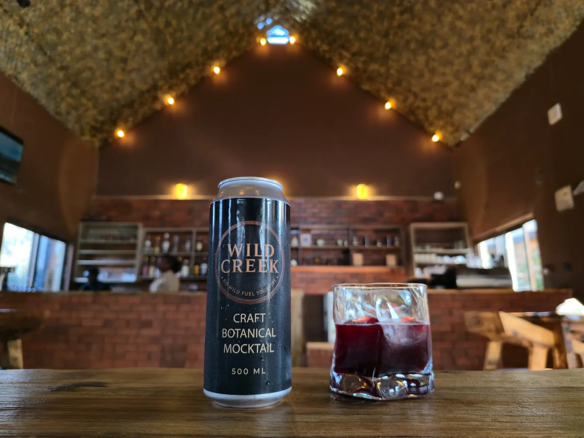 A Wild Creek can and a poured glass on the bar at Kenol